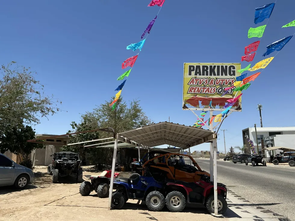 La Palapa rental entrance with papel picado and the fleet