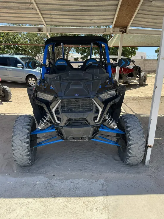 Blue 2-seat Polaris RZR side-by-side from the La Palapa fleet