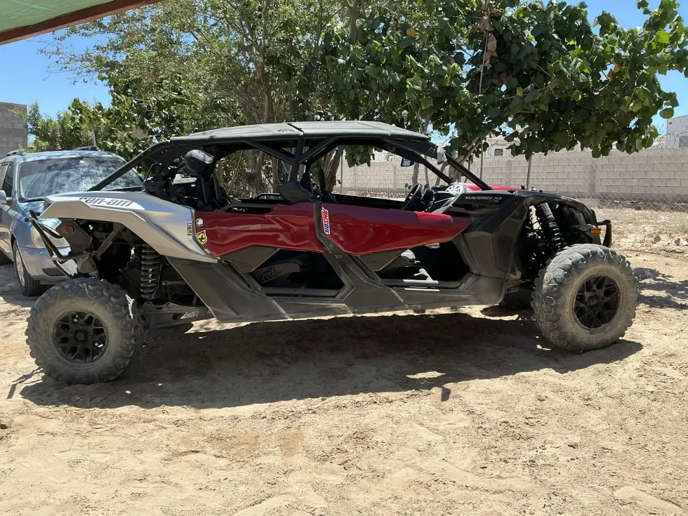 Side view of a red Can-Am side-by-side